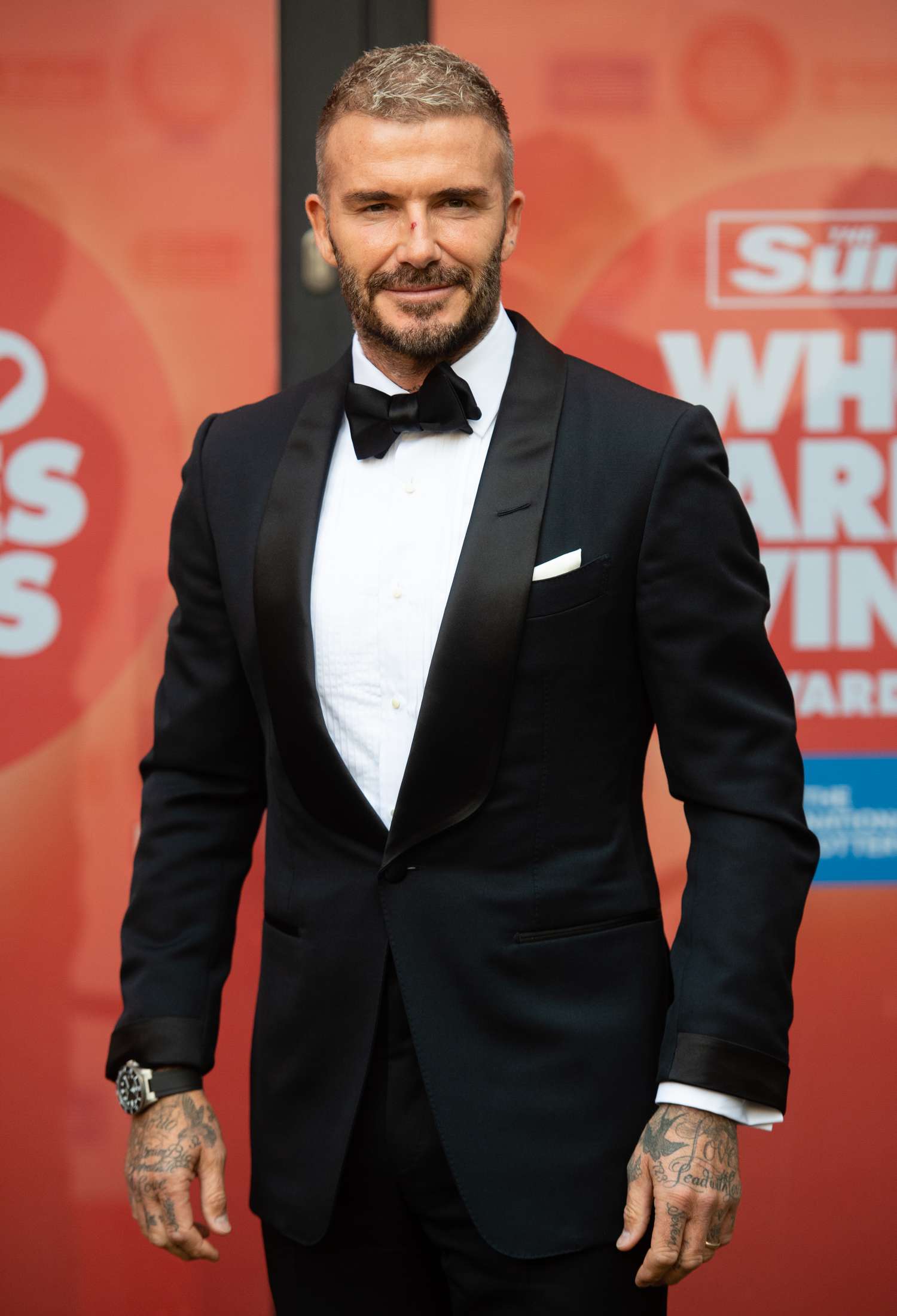 David Beckham wearing a black tuxedo