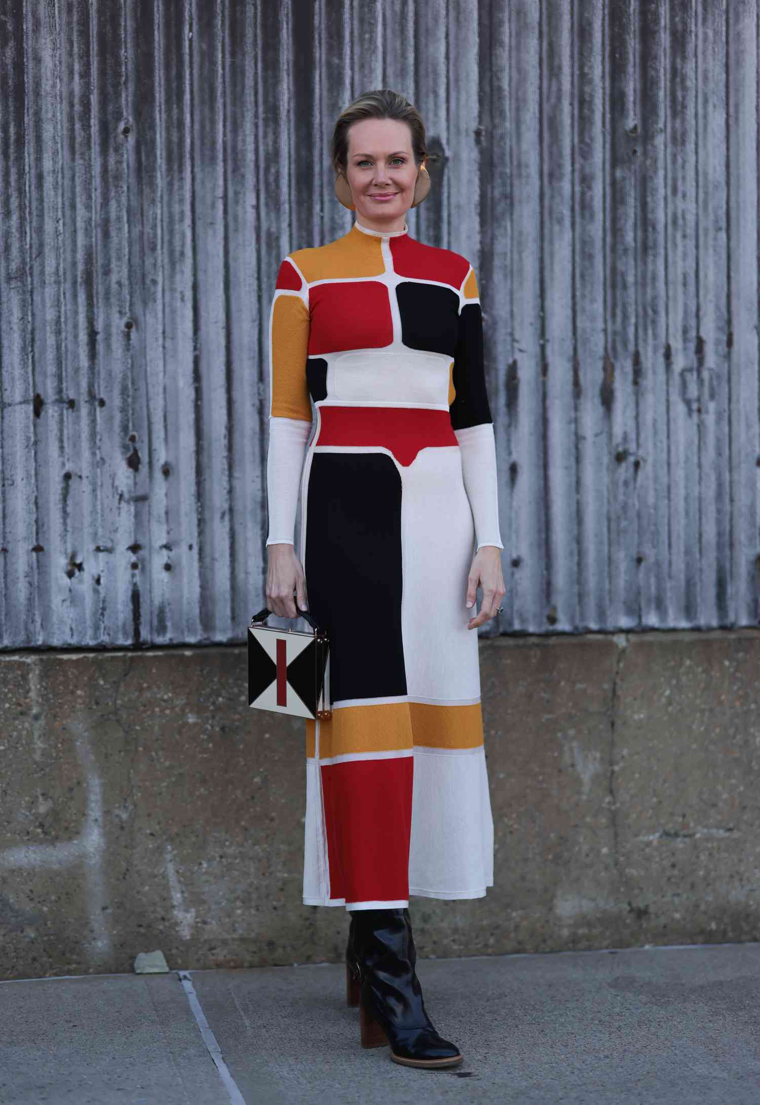 A woman wears a color-block dress, a Libra outfit to try for 2023.