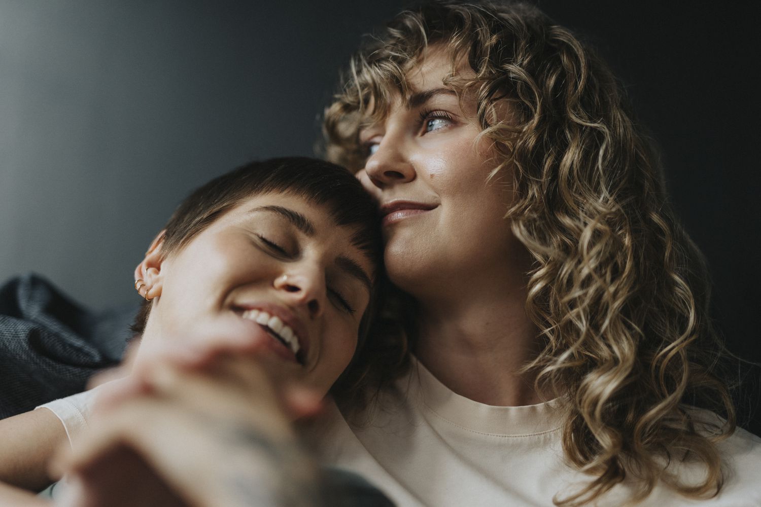 Couple cuddling in bed