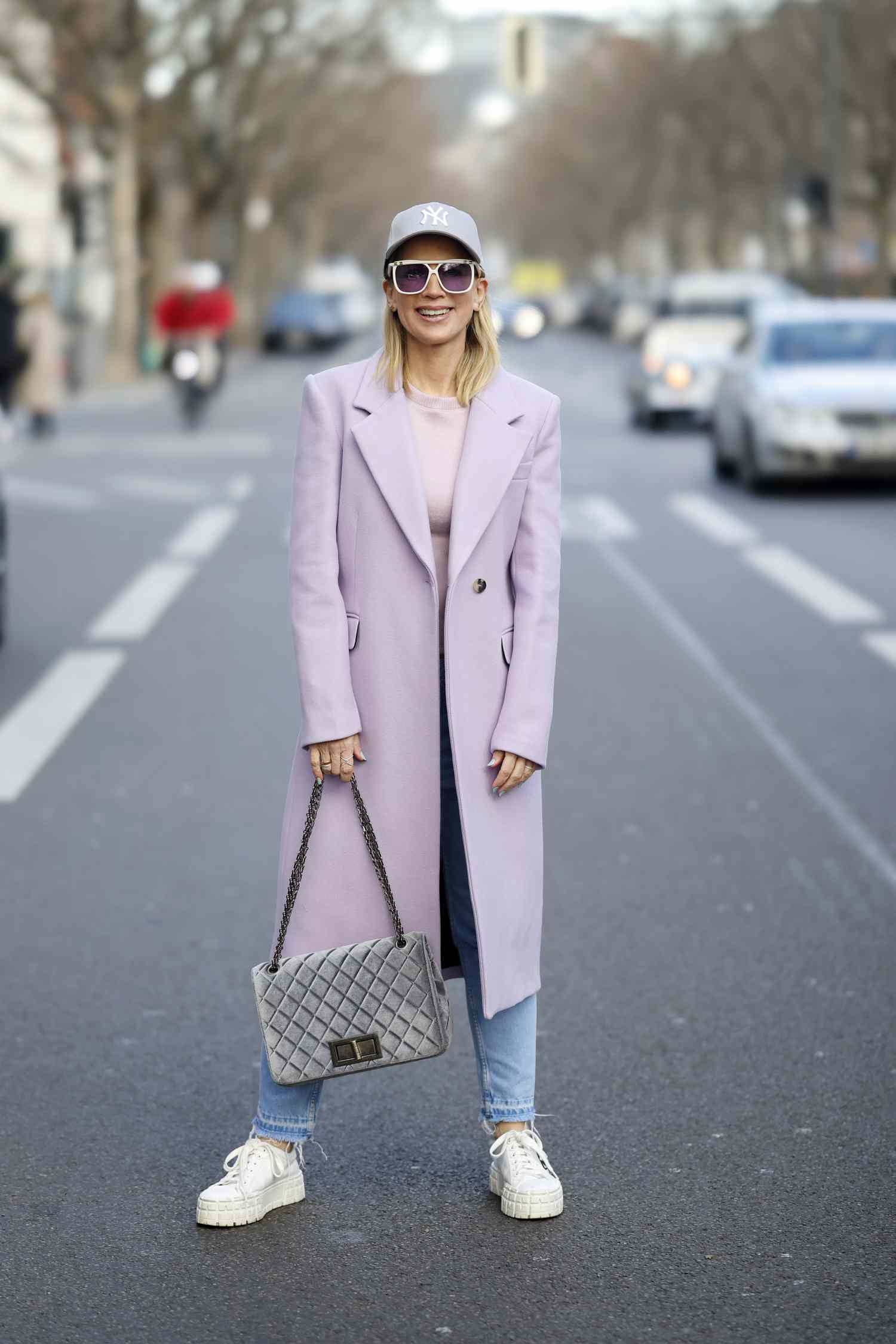 Tamara von Nayhauss wears a pale purple trench coat, a libra outfit to try for 2023.