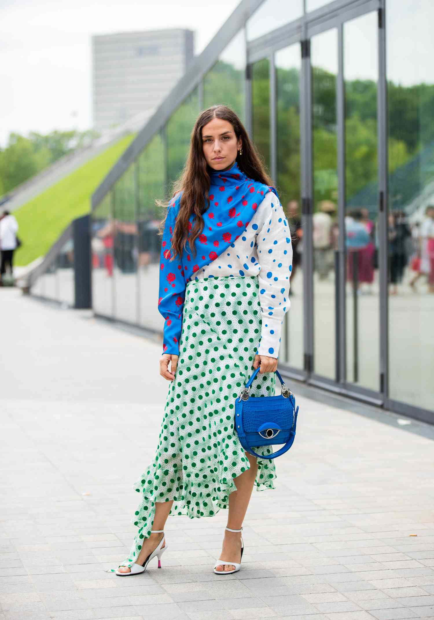 Erika Boldrin wearing two tone dress with dots prints with blue satchel Sagittarius outfits