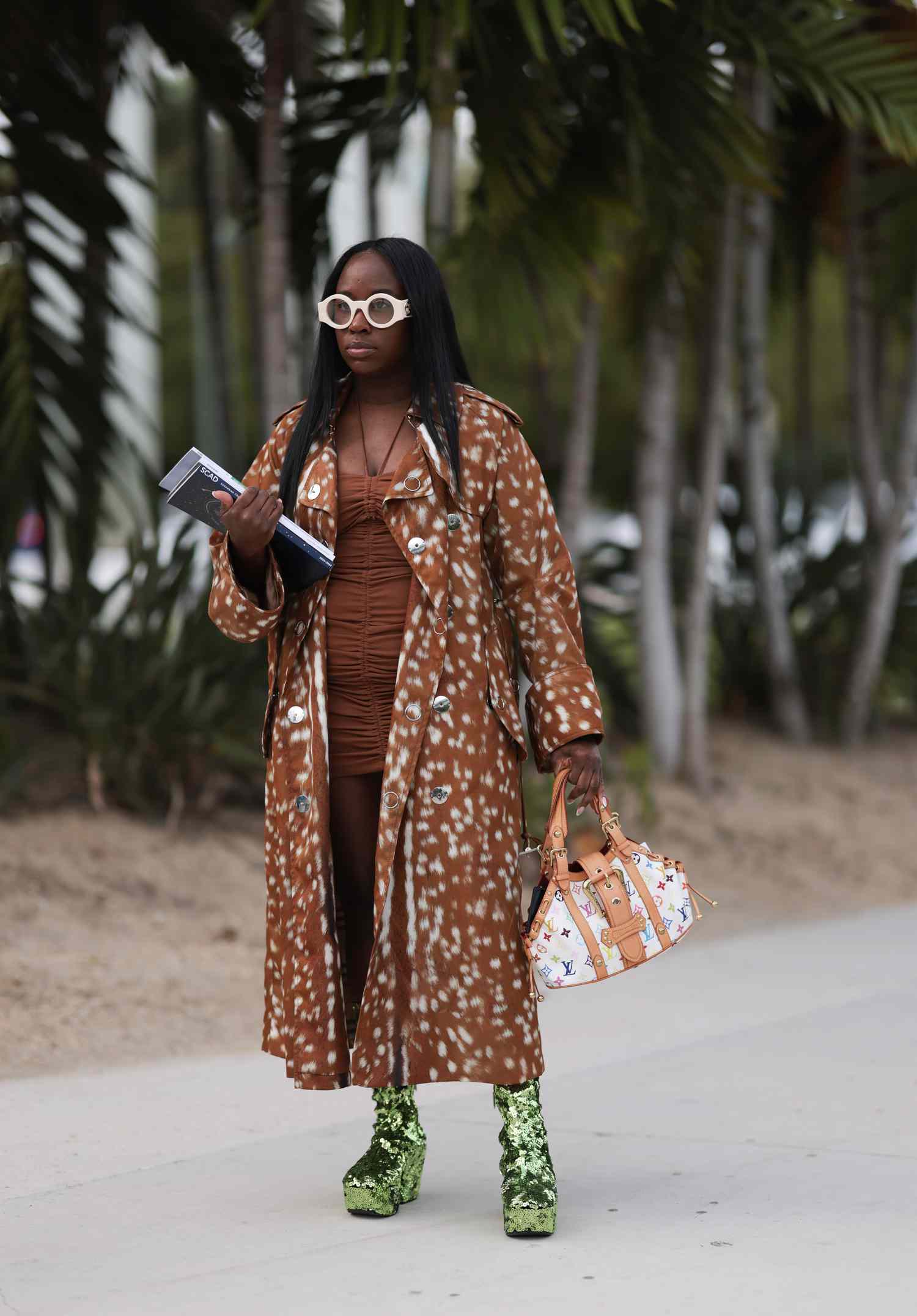 A woman wearing a printed coat