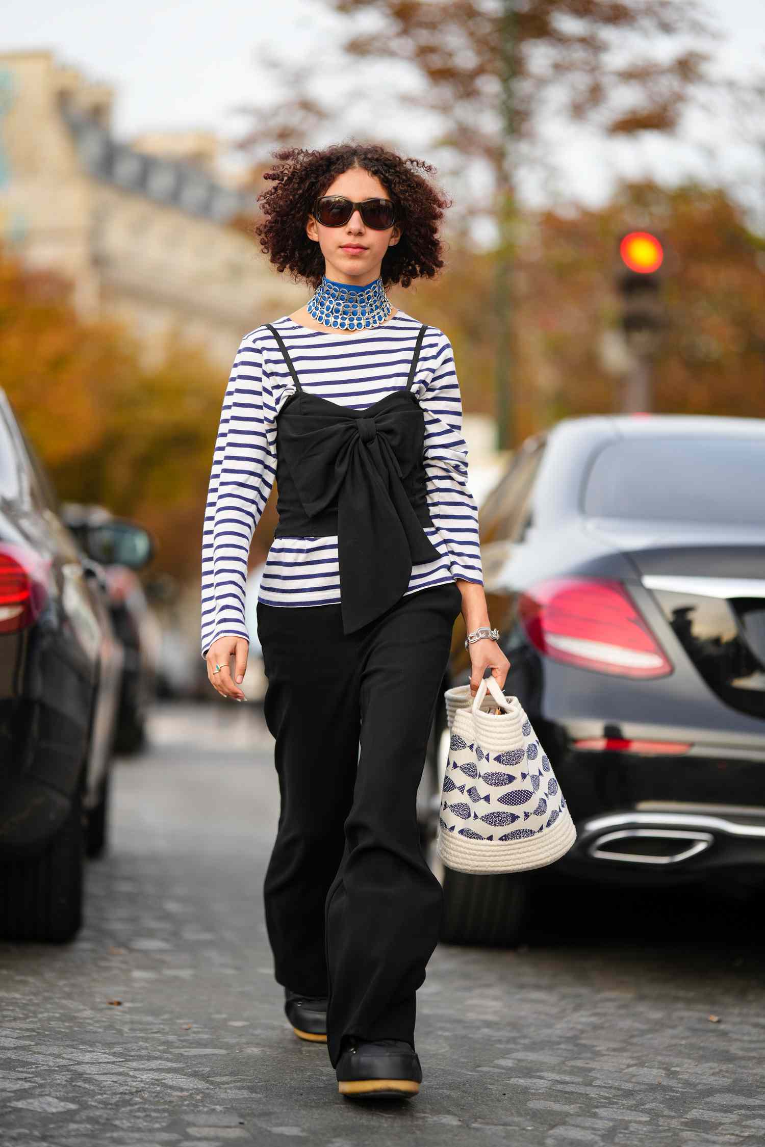 A woman wearing a striped top oufit