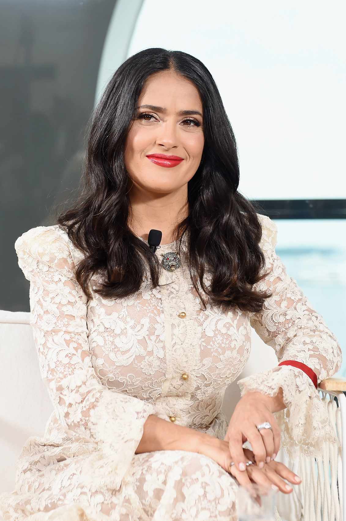 Salma Hayek wearing a white lace dress