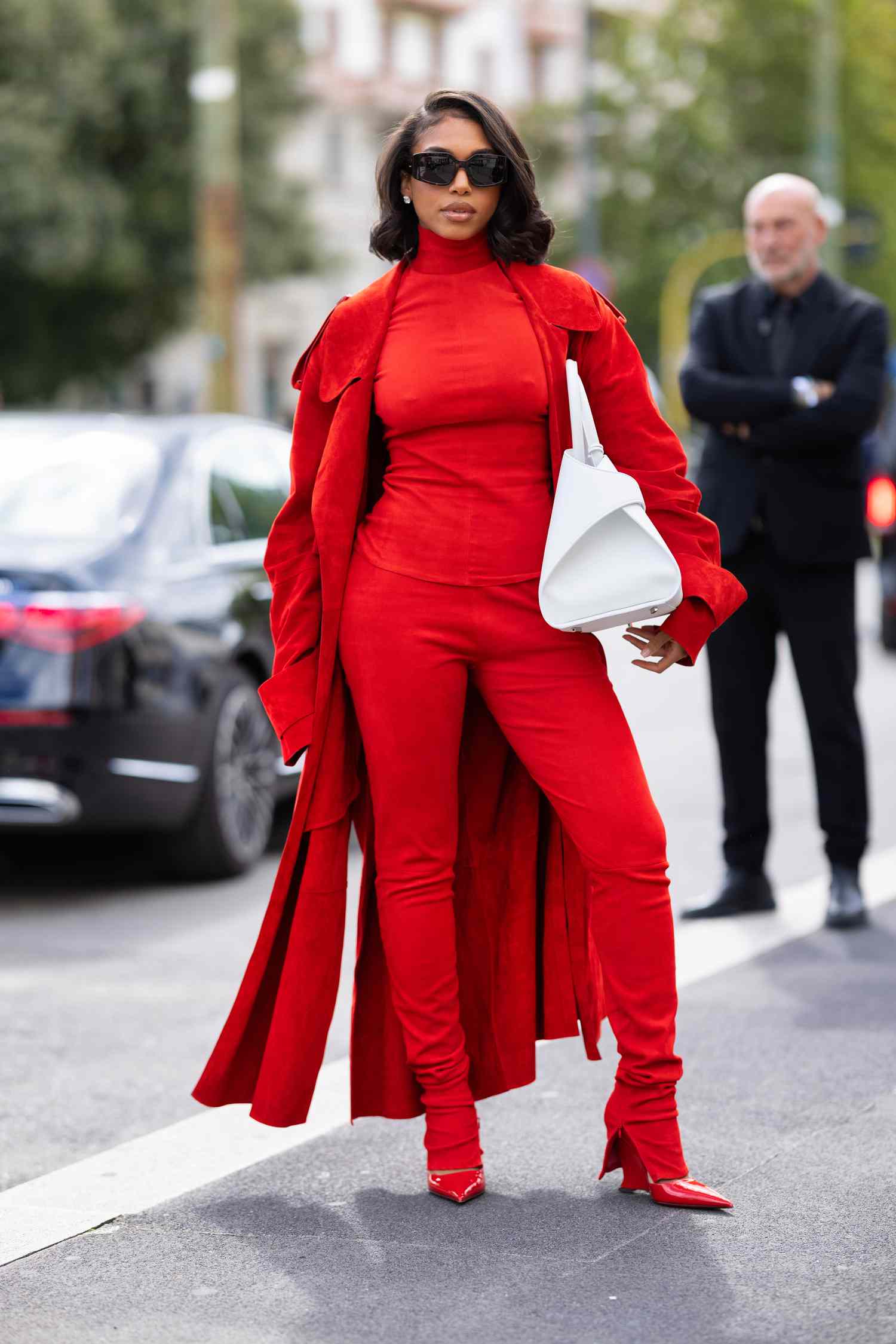 Lori Harvey wears a monochromatic red outfit, a 2023 Scorpio outfit idea for women.