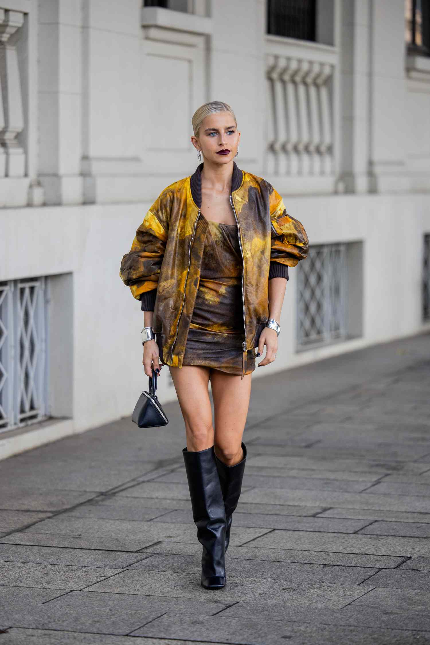 Caroline Caro Daur wears a patterned skirt set and a matching patterned bomber jacket, a 2023 Scorpio outfit for women to try.