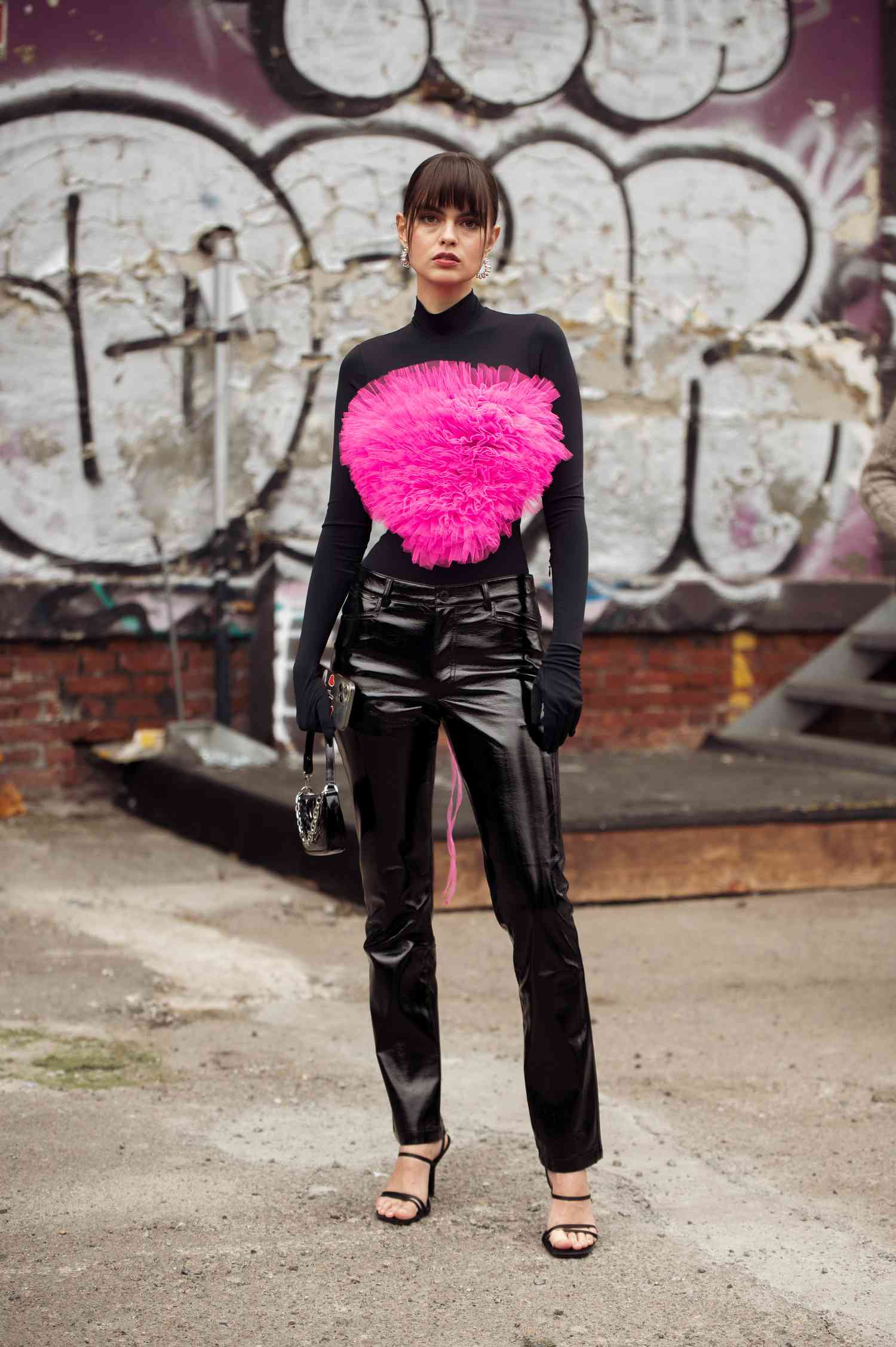 Vladislava Evtushenko wears black leather pants, a 2023 Scorpio outfit for women.