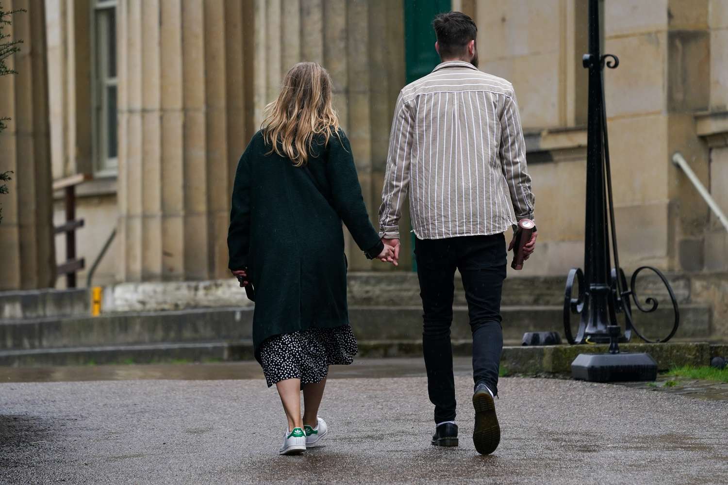 Couple walking holding hands