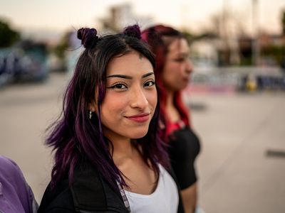 A woman standing with friends.