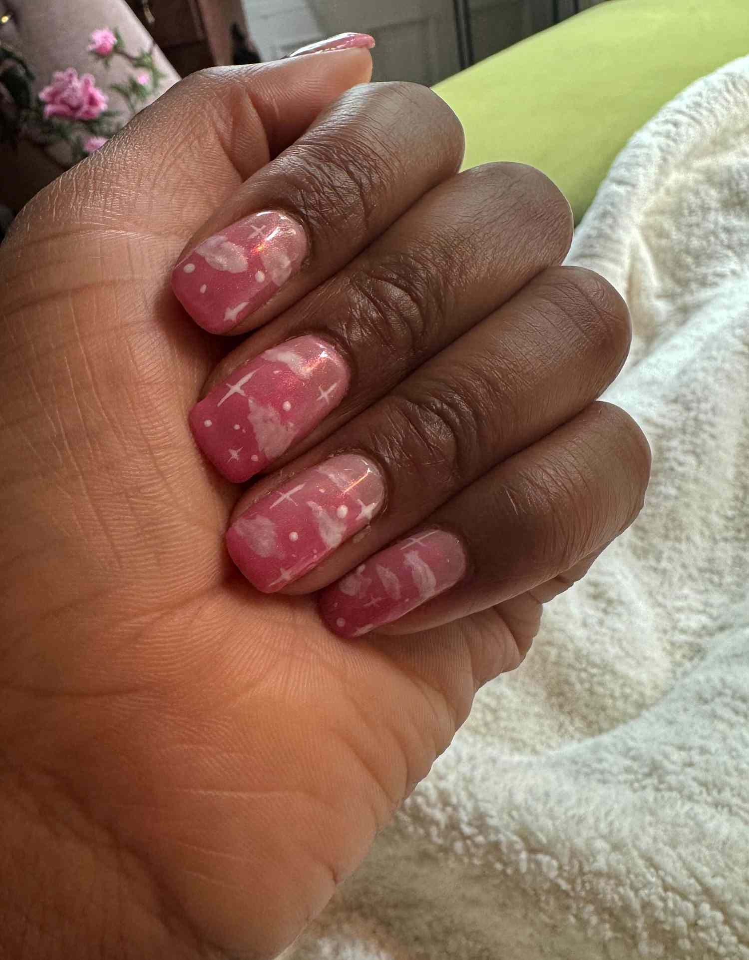 A manicure featuring pink clouds.