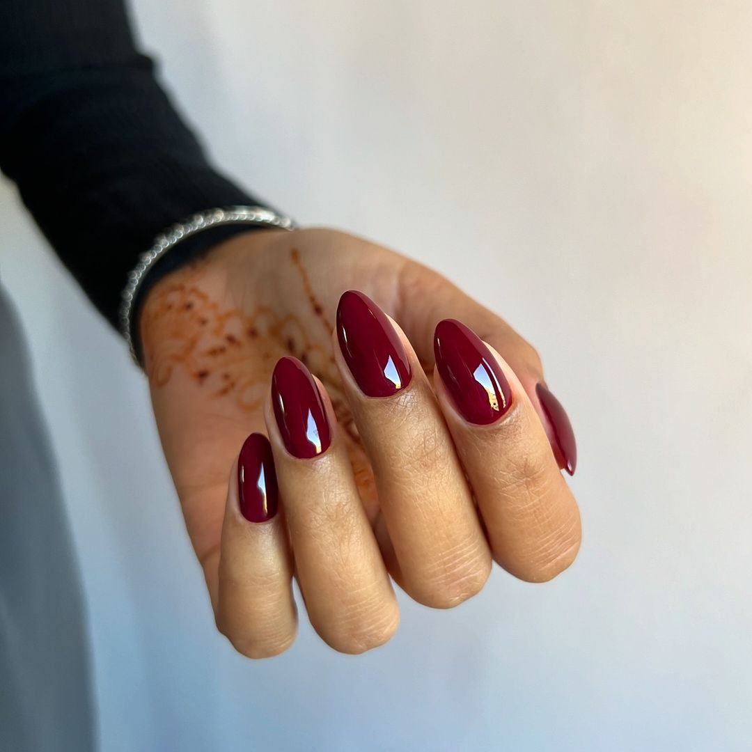 A deep burgundy nail design for scorpio season.