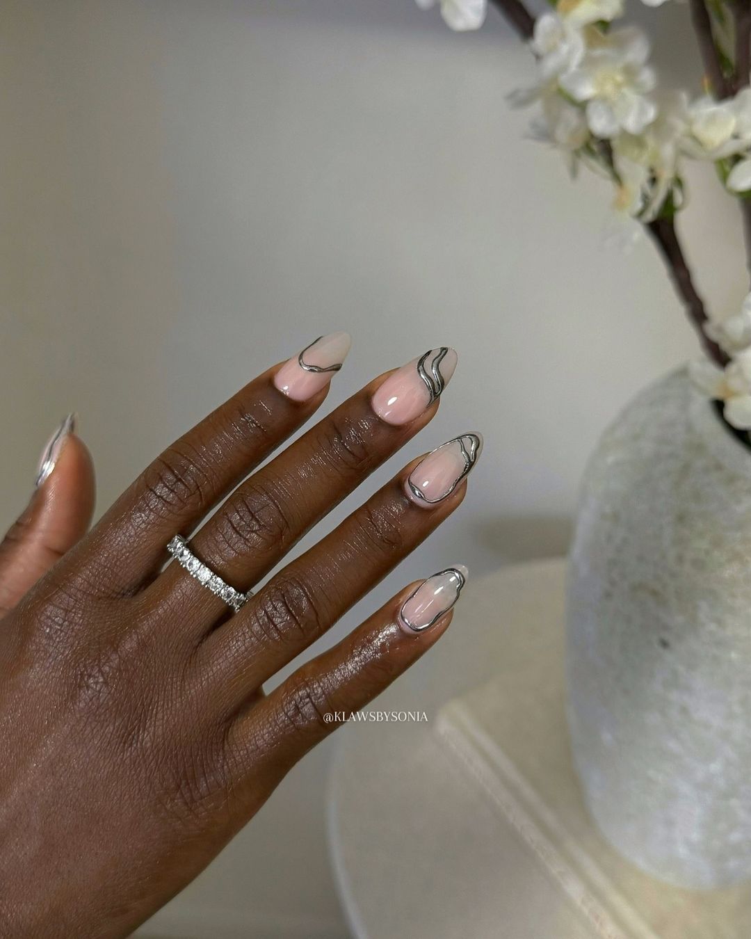 A silver chrome nail look for Scorpio season.