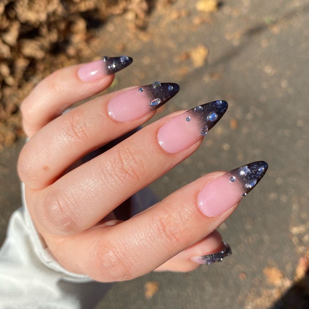 A black French tip with stones for Scorpio seson.