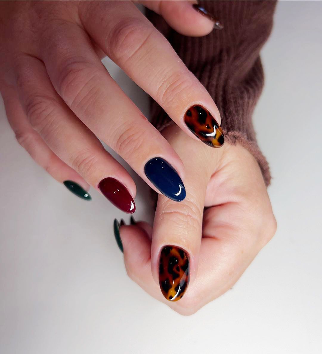 A jewel-toned tortoiseshell nail design for Scorpio season.