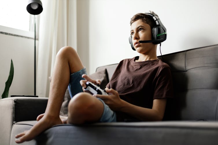 A boy playing a video game.